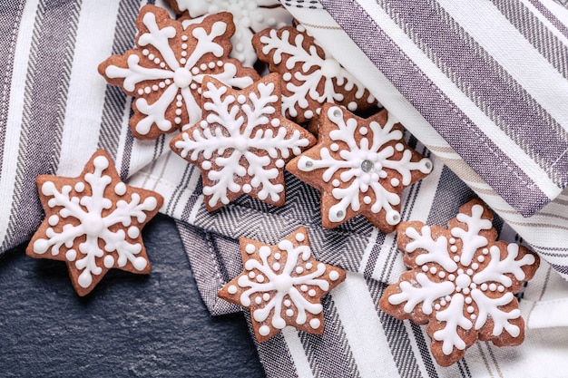 Top view of gingerbread cookies on napkin on the slate table