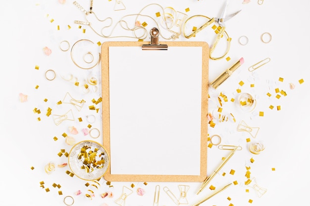 Top view on gold style feminine accessories clipboard