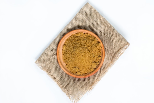 top view of granulated panela on white background with copy space