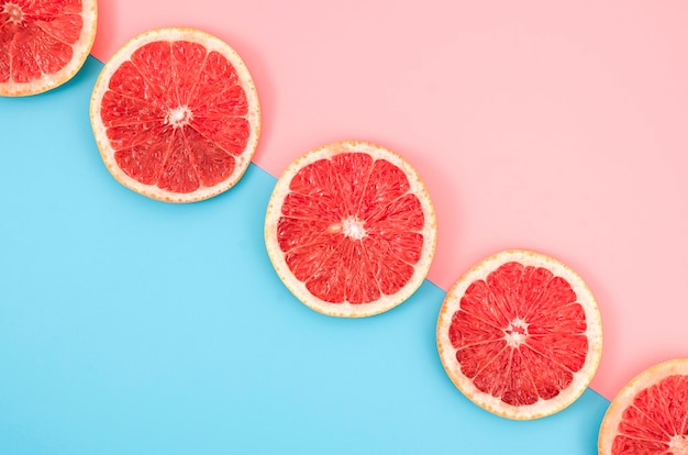 Top view grapefruit slices on table