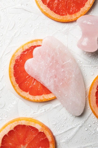 Top view gua sha and grapefruit arrangement