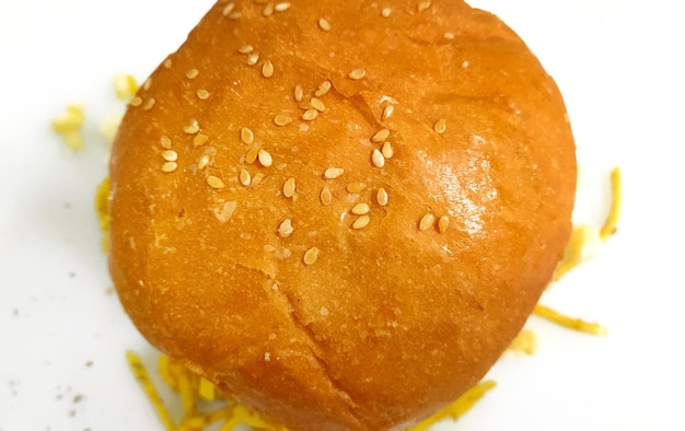 Top view of hamburger with cheese tomato and onions on White background with copy space for text