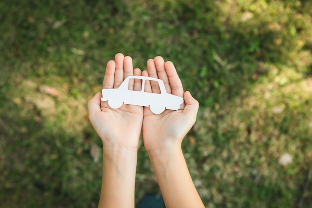 Top view hand holding ev car icon symbolize ecofriendly business gyre