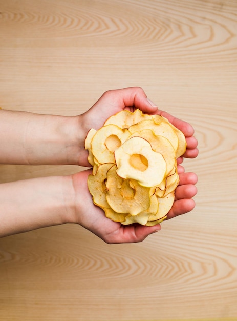 Top view handful of round dried slices of apple