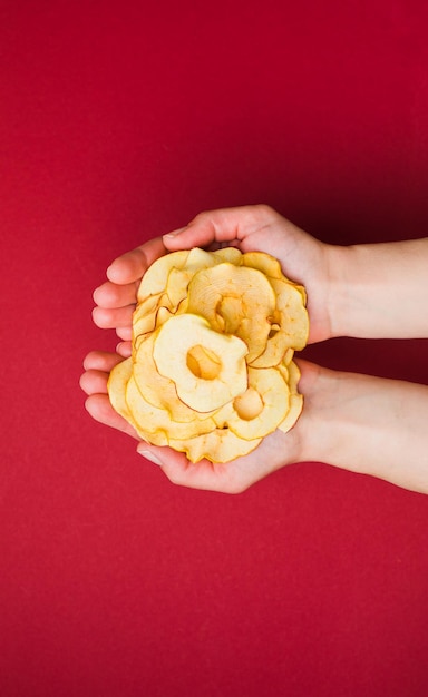 Top view handful of round dried slices of apple