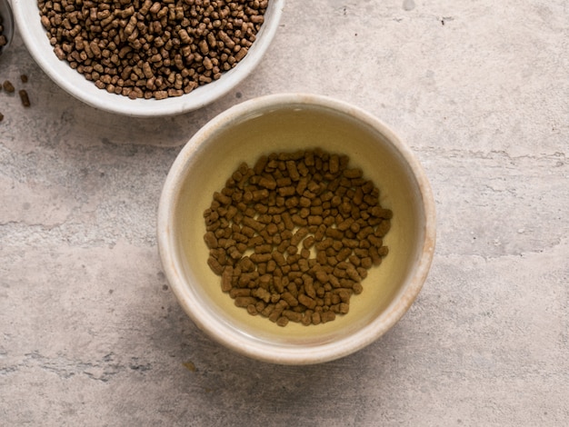 Top view of healthy soba tea and groats of tartary buckwheat  Ku Qiao seeds on light surface. Flat lay. Copy space