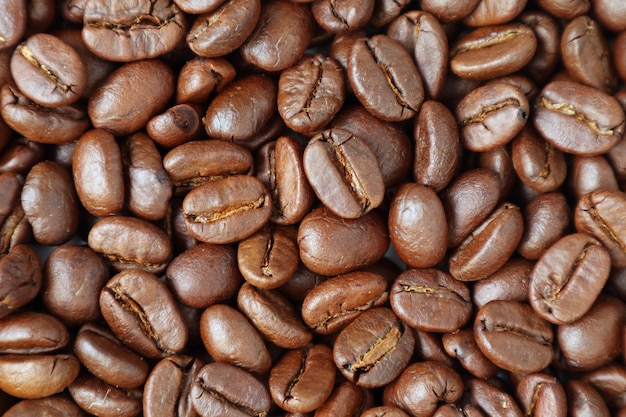 Top view of heap of roasted coffee beans for background or banner