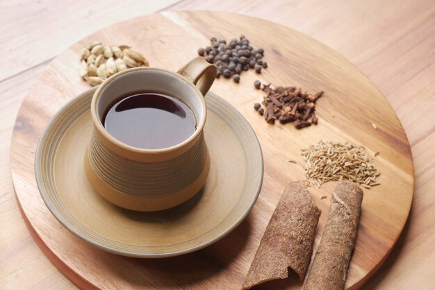 Top view of herbal tea and ingredient on table