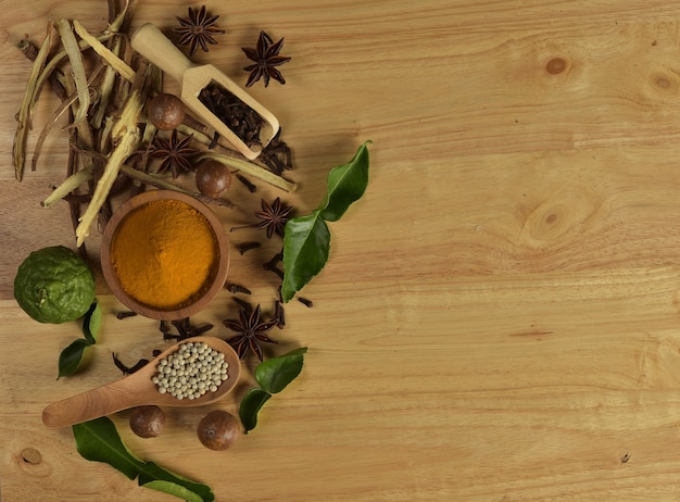 Top view of heubs on wooden background