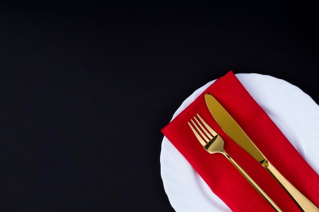 Top view of holiday table setting on the black background Copy space Closeup