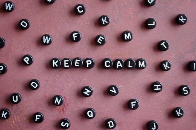 Top view image of alphabet beads with text KEEP CALM