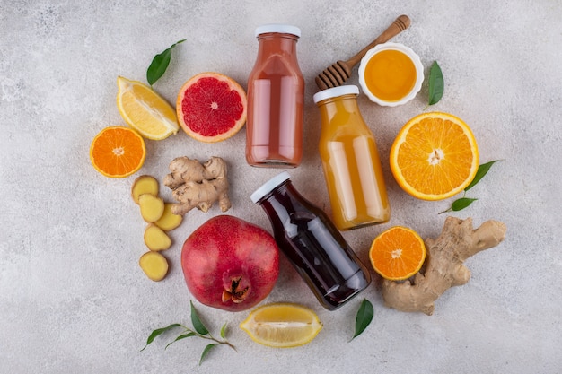 Top view of immunity boosting foods and juice with citrus and ginger