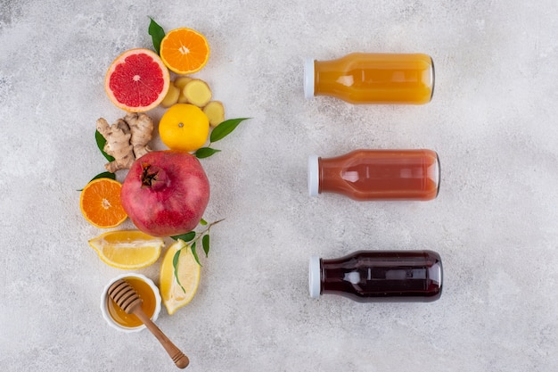 Top view of immunity boosting foods and juice with citrus and ginger