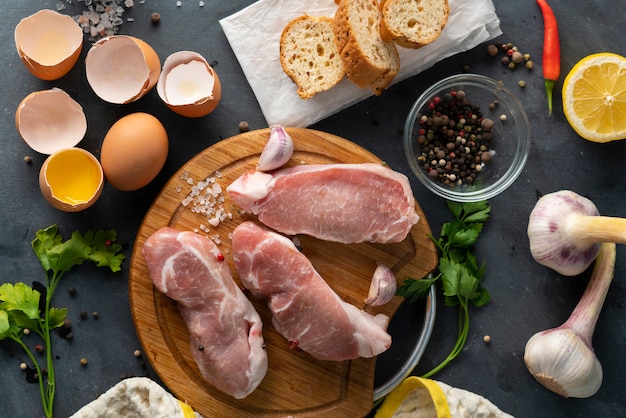 Top view of ingredients for cooking  South Africa traditional meal  Bobotie on a wooden cutting boards