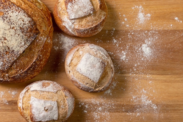 Top view of italian bread prepared with natural fermentation on wooden background