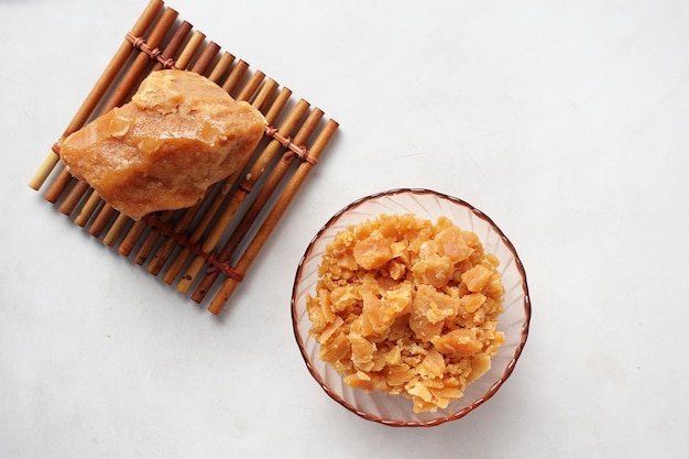 top view of jaggery traditional cane sugar cube on white background