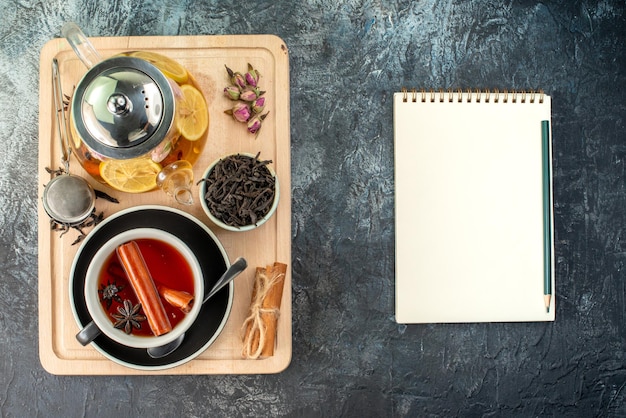 Top view lemon tea in cup and kettle on a gray background fruit breakfast ceremony color food morning photo