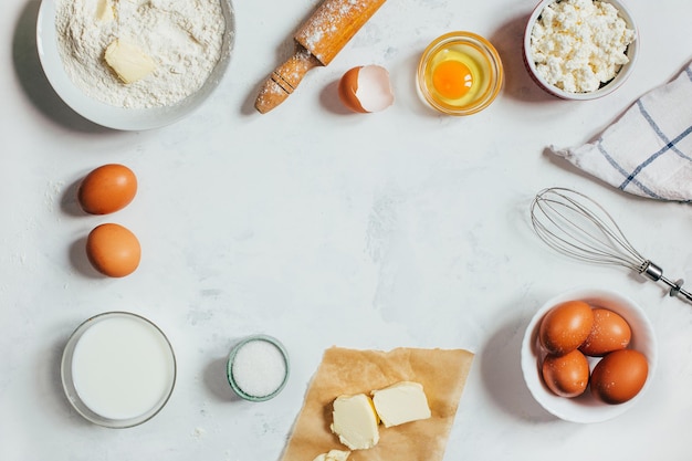 Top view on light background with ingredients for making dough