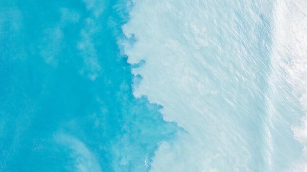 Top view of light blue water with white sand