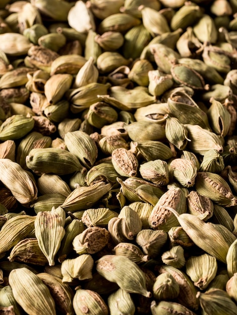 Top view macro closeup on plenty of green cardamom spice