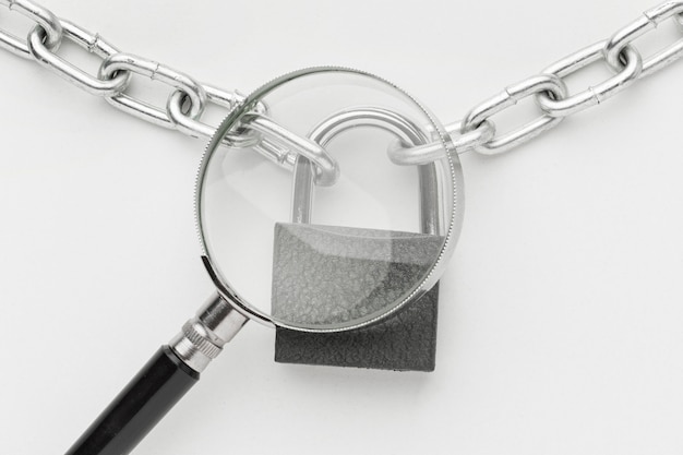 Top view of magnifying glass with lock and metal chain