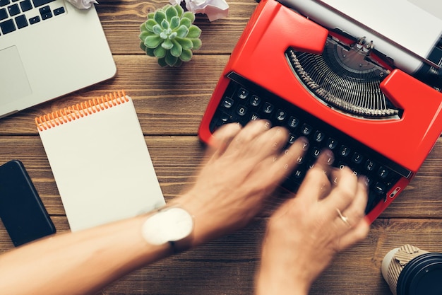 Top view of man using typewriter