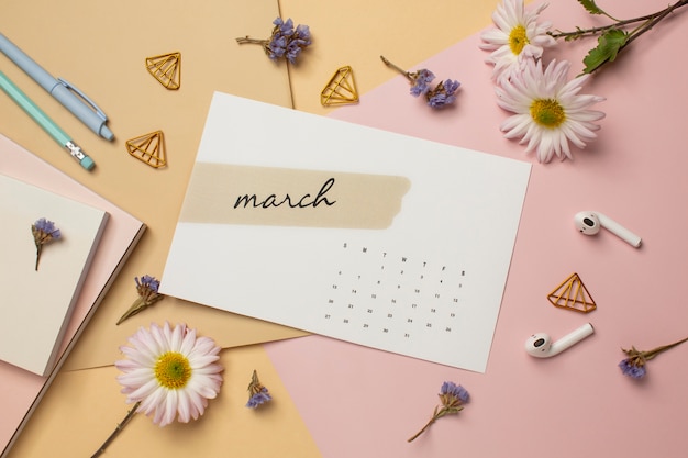 Top view march calendar and flowers