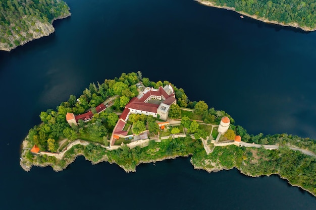 Top view of medieval zvikov castle with traditional red roofs river and forest in south bohemia reg