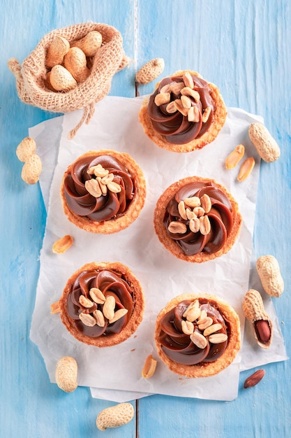 Top view of mini tartlets with butterscotch and nuts