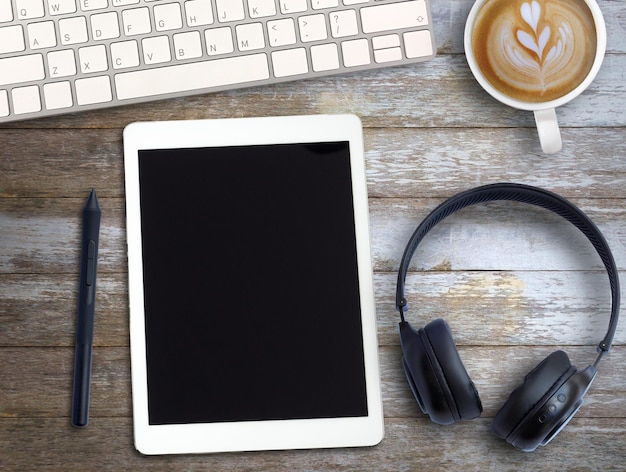 Top view Minmal workspace with keyboard white paper and coffee cup on wood table background