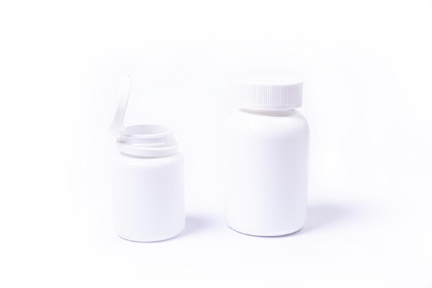 Top view mockup bottle for pills and vitamins with green leaves natural organic bio supplement