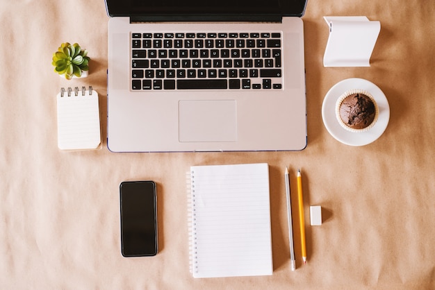 Top view of modern business and blog workspace set up on the office desk.