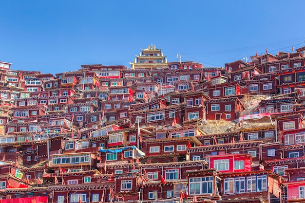 Top view monastery at Larung gar (Buddhist Academy) in sunshine day and background is blue sky, Sichuan, China