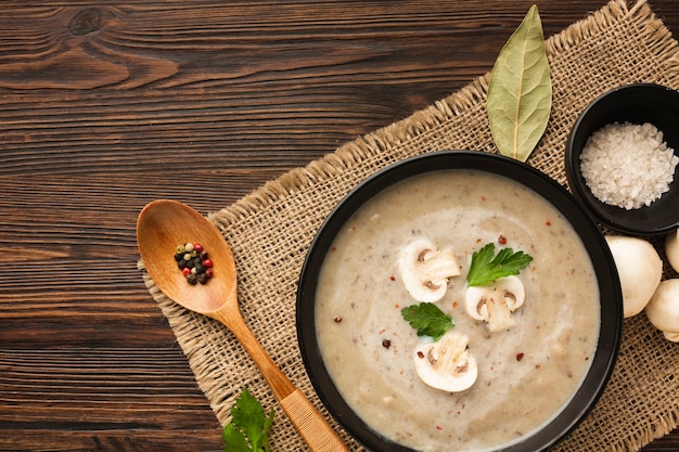 Top view mushrooms bisque and spoon