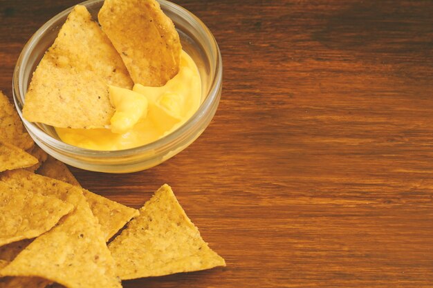 Top view of nachos with cheese dip