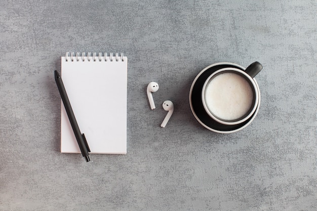 top view office desk with notebook and cup of coffee