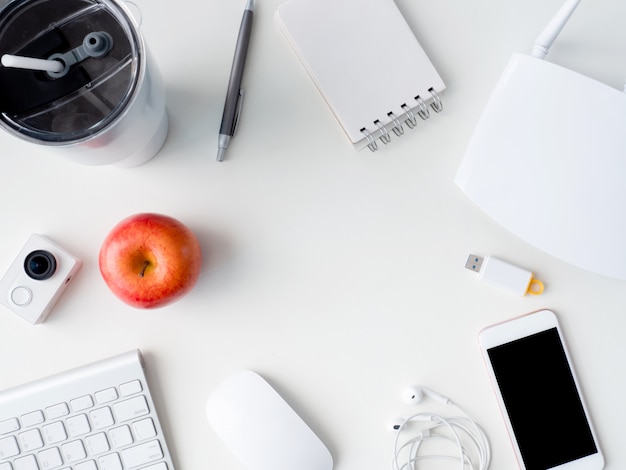 top view of office desk workspace with notebook, phone and gadget on white background, graphic designer, Creative Designer concept.