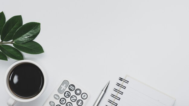 Top view of office supplies and notebook on white background 