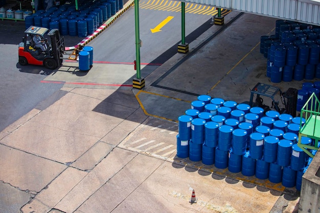 Top view oil barrels forklift truck move for on the transportation worker help