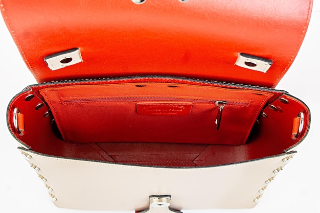 Top view of open empty women lady bag isolated on white background