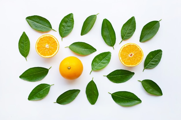 Top view of orange fruits  with  green leaves, isolated on white background.