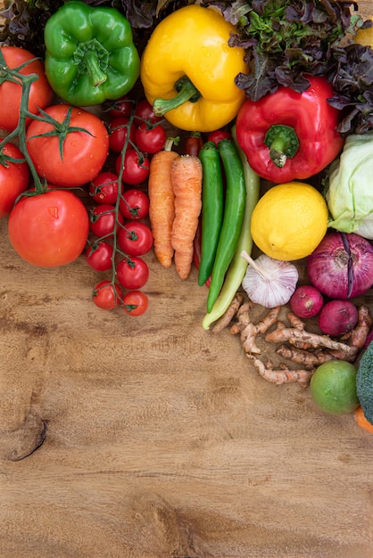 Top view of Organic food on wooden board, Composition with assorted raw organic vegetables