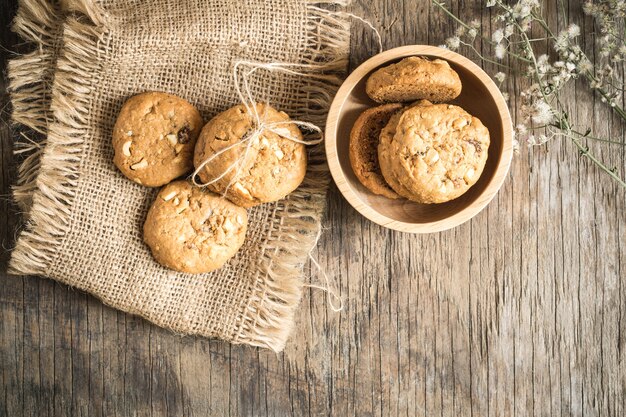 Top view and overhead shot of cookies on old wooden background,Homemade cookies on sackclo