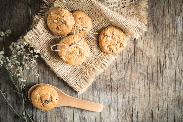 Top view and overhead shot of cookies on old wooden background