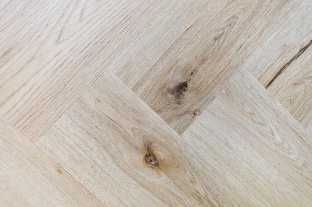 Top view of a parquet floor under natural light Wooden pattern with oak diagonal texture