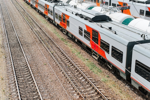 Top view passenger and freight trains on rails outdoors copy space