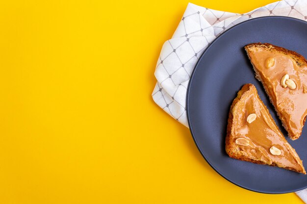 Top view of Peanut butter toasts on plate