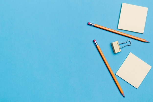 Top view pencils with sticky notes on the table