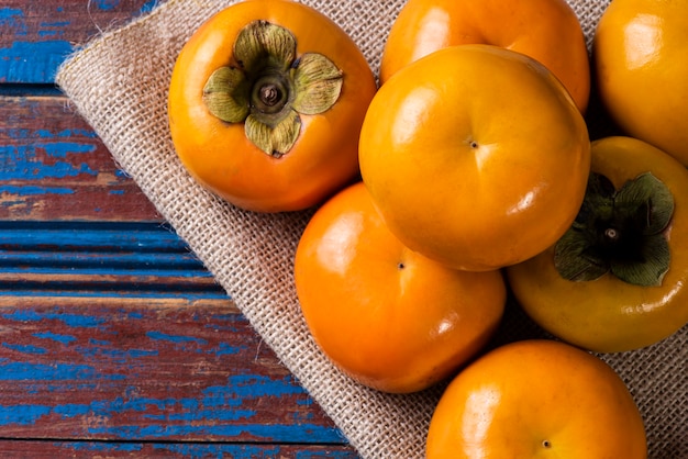 top view persimmons on table