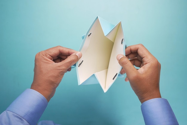 Top view of person open a empty small gift box